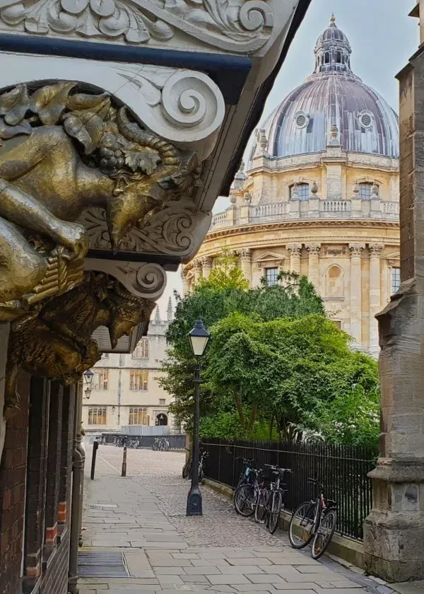 St. Mary's Passage, Oxford, resembling the passageway into C. S. Lewis' Narnia. The Radcliffe Camera is in the background.