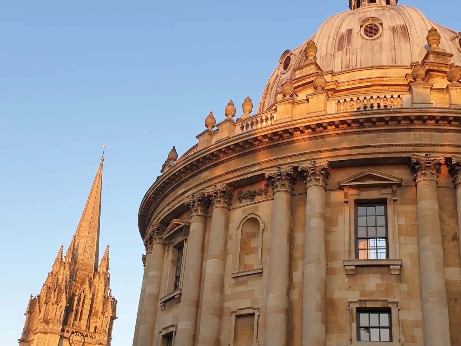 The Radcliffe Camera, Oxford, in evening light, with the University Church in the background